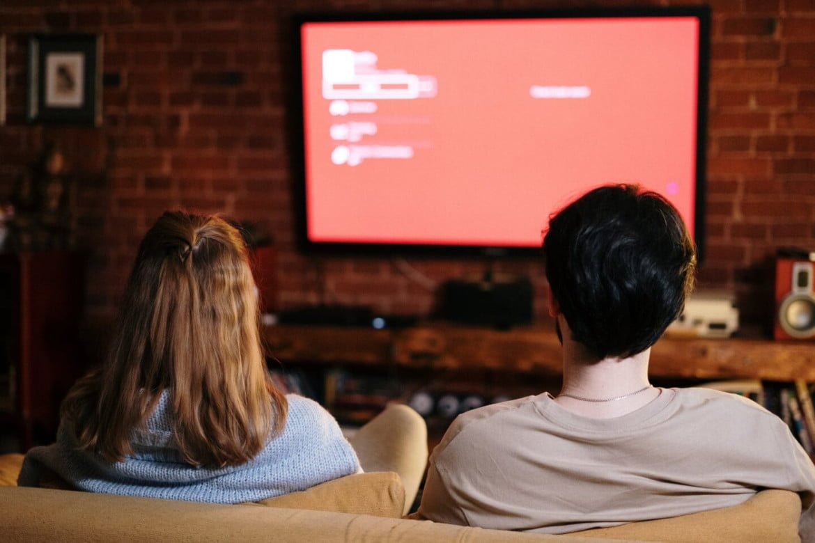 people watching on a television
