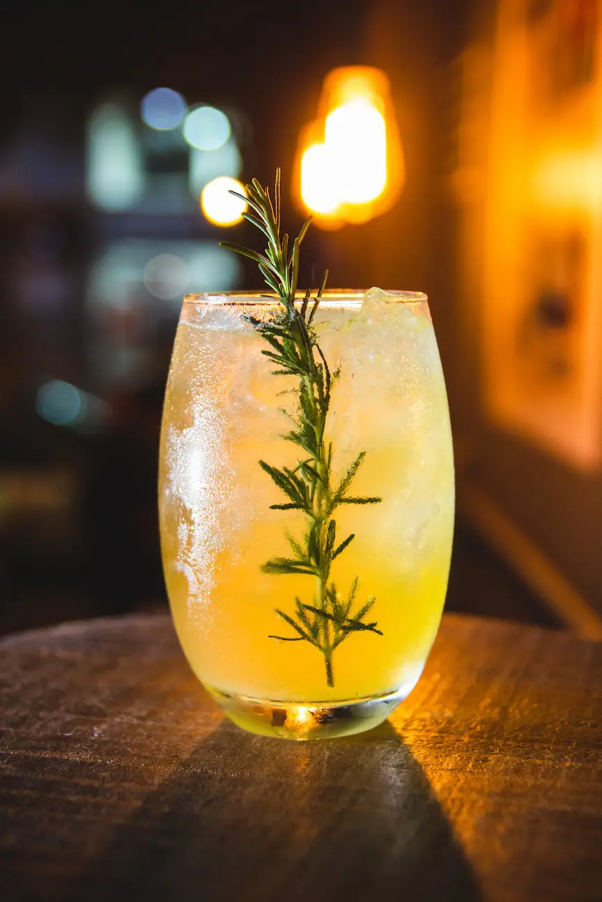 drink with rosemary herb in clear glass